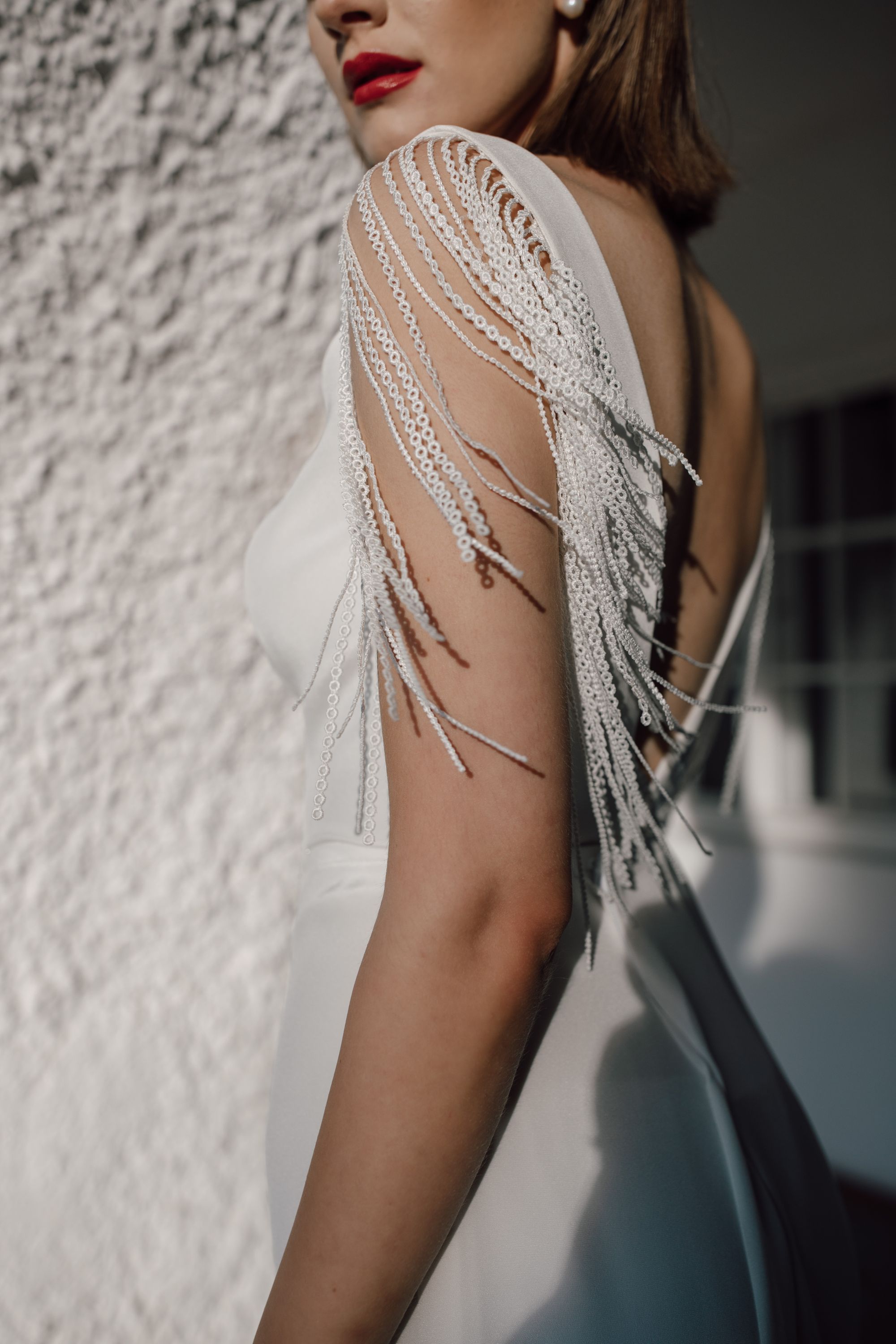 Brautkleid mit Fransenärmeln